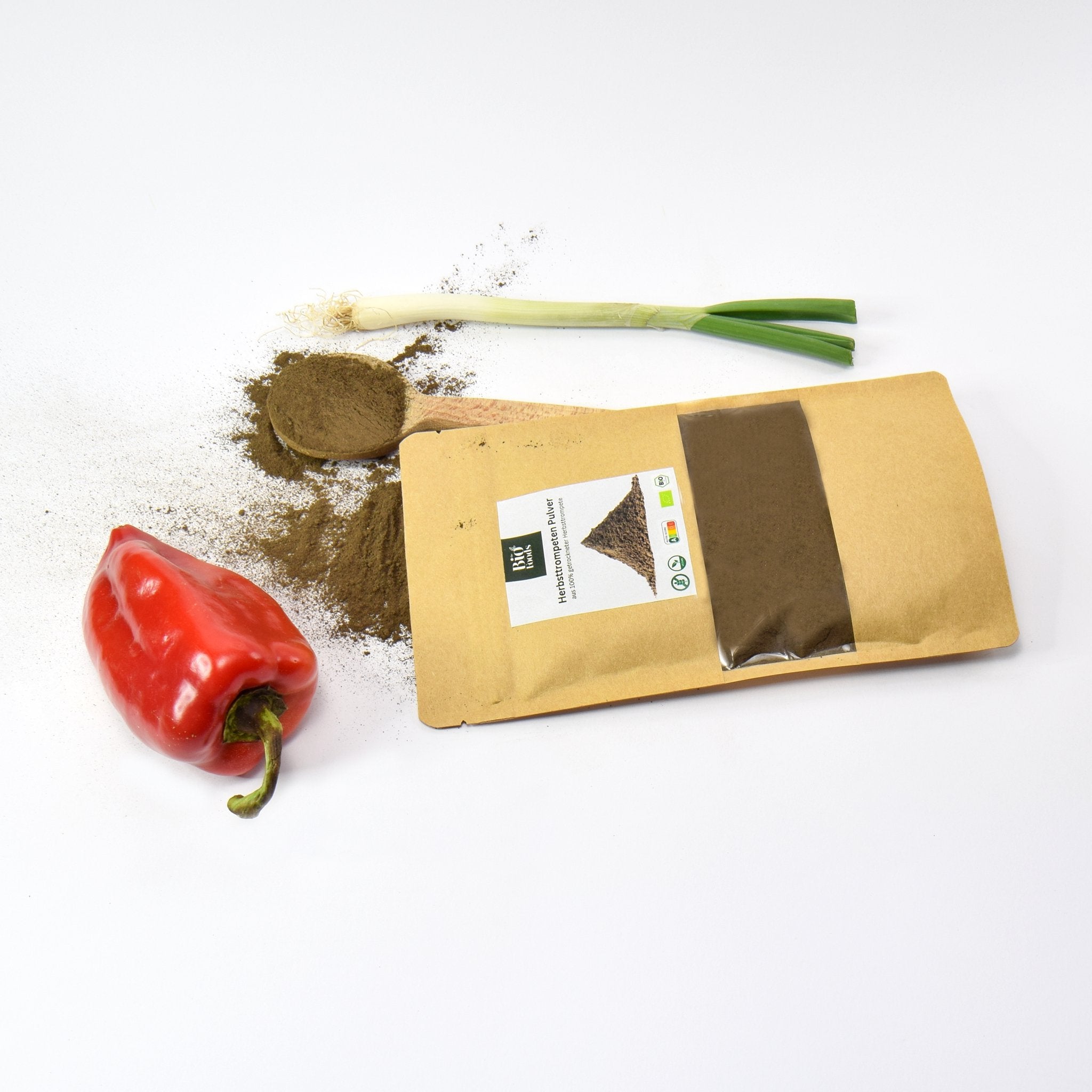 Organic Black Trumpet Powder witg veggies on the table - The Bio Foods